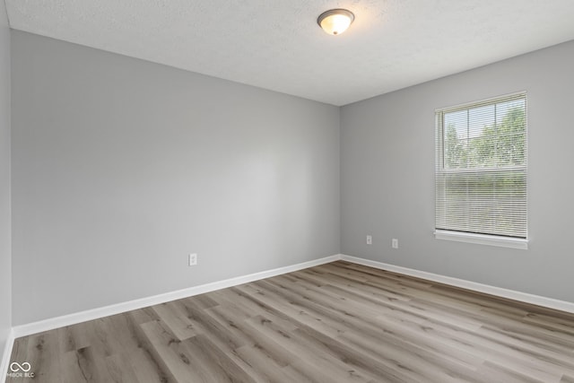 2359 Bremhaven Ct, Indianapolis, IN 46229 - empty room with wood finished floors and a textured ceiling