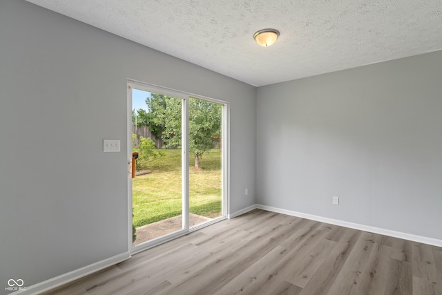 2359 Bremhaven Ct, Indianapolis, IN 46229 - empty room featuring wood finished floors and a textured ceiling
