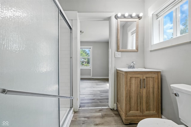 3424 Orchard Ave, Indianapolis, IN 46218 - bathroom with a shower stall, vanity, and wood finished floors