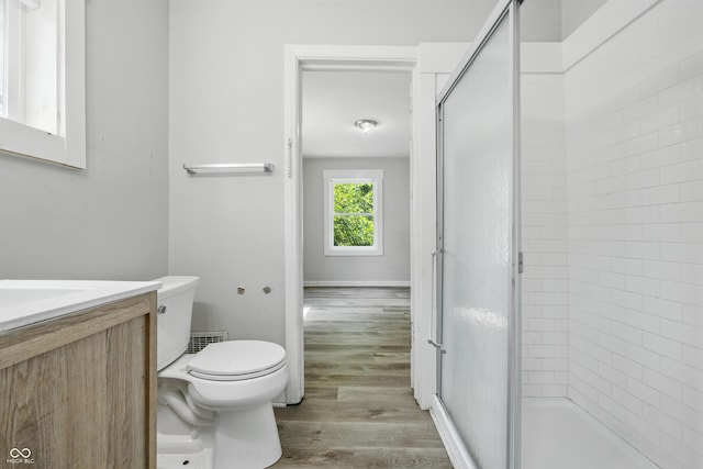 3424 Orchard Ave, Indianapolis, IN 46218 - full bathroom with a stall shower, wood finished floors, and vanity