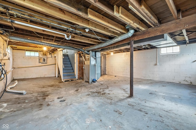 3424 Orchard Ave, Indianapolis, IN 46218 - below grade area with stairway, electric panel, and heating unit