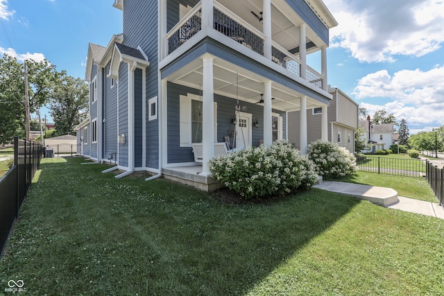 847 E Jefferson St, Franklin, IN 46131 - view of side of home with a balcony, a fenced backyard, a porch, and a ceiling fan