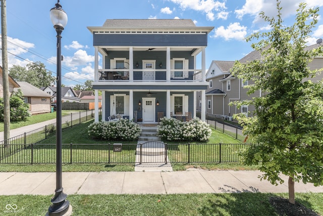 847 E Jefferson St, Franklin, IN 46131 - view of front of house with covered porch, a balcony, a gate, and a fenced front yard