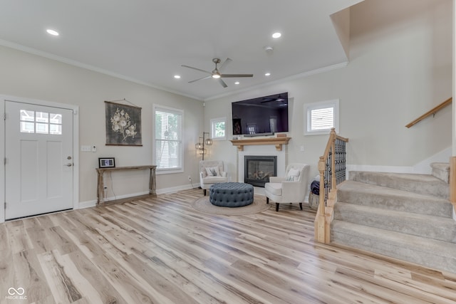 847 E Jefferson St, Franklin, IN 46131 - living room featuring ornamental molding, stairway, wood finished floors, a glass covered fireplace, and ceiling fan