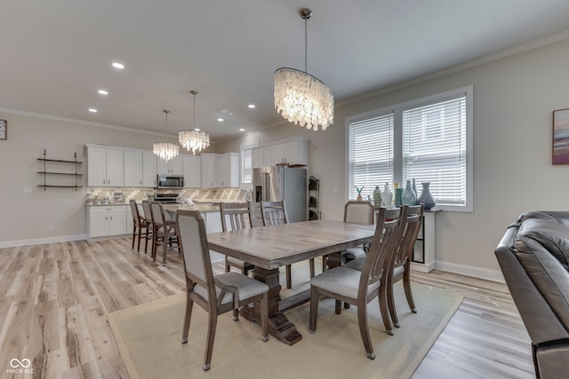 847 E Jefferson St, Franklin, IN 46131 - dining area with a chandelier, ornamental molding, light wood-style flooring, and recessed lighting