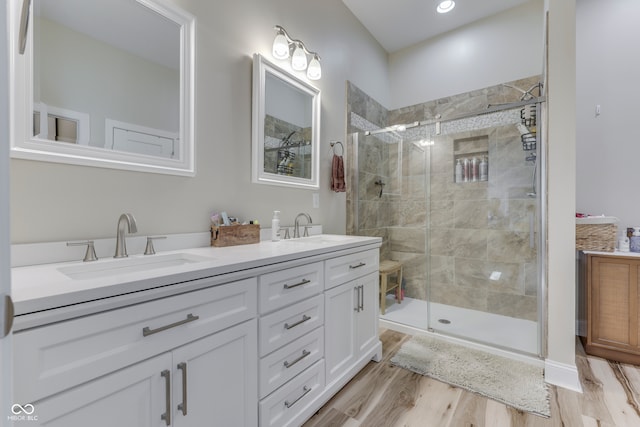 847 E Jefferson St, Franklin, IN 46131 - full bathroom with double vanity, a stall shower, and wood finished floors
