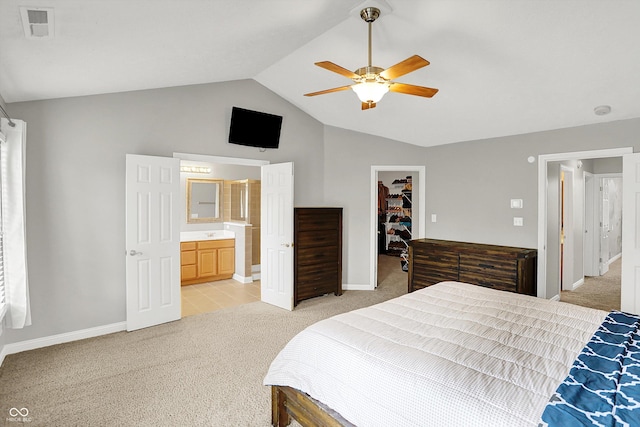 421 Lowry St, Jamestown, IN 46147 - bedroom with light colored carpet, a walk in closet, vaulted ceiling, a closet, and ensuite bath