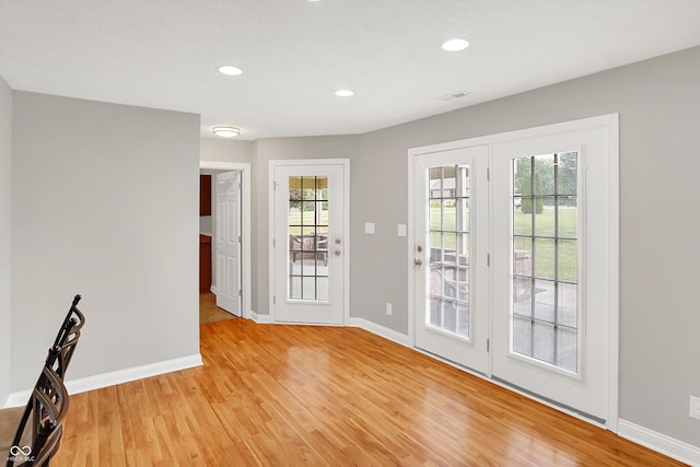 421 Lowry St, Jamestown, IN 46147 - doorway with light wood finished floors and recessed lighting