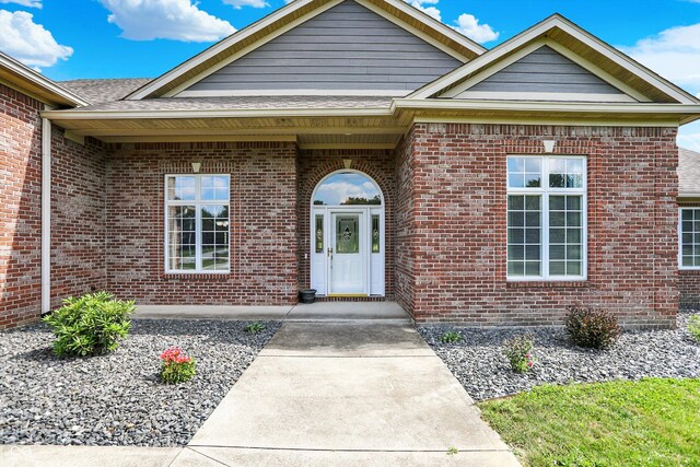 421 Lowry St, Jamestown, IN 46147 - view of exterior entry with brick siding and a shingled roof