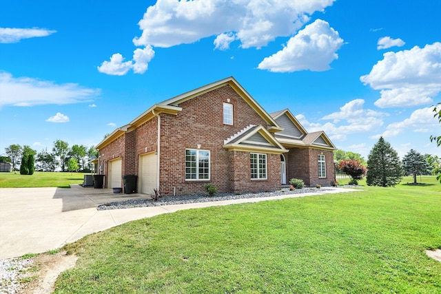 421 Lowry St, Jamestown, IN 46147 - view of front of home with brick siding, concrete driveway, and a front yard