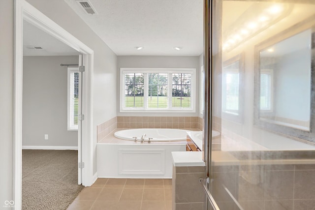 421 Lowry St, Jamestown, IN 46147 - bathroom with a garden tub, tile patterned floors, a textured ceiling, and an enclosed shower