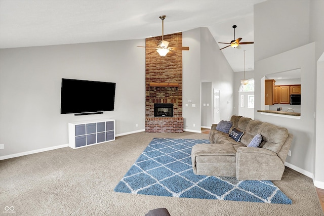 421 Lowry St, Jamestown, IN 46147 - carpeted living area with ceiling fan, high vaulted ceiling, and a brick fireplace