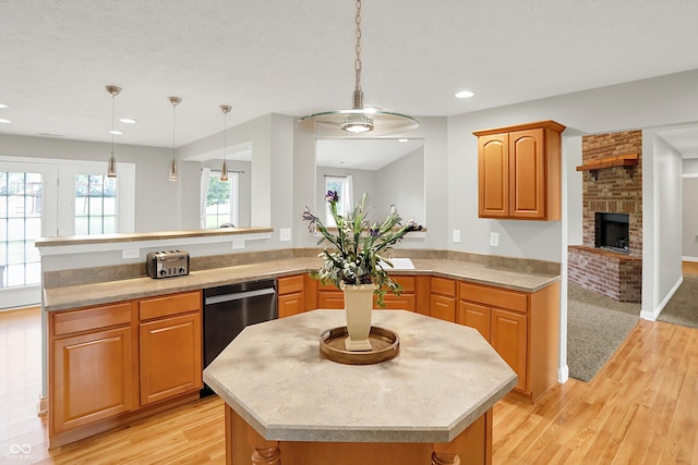 421 Lowry St, Jamestown, IN 46147 - kitchen featuring dishwasher, light countertops, light wood-style flooring, recessed lighting, and a textured ceiling
