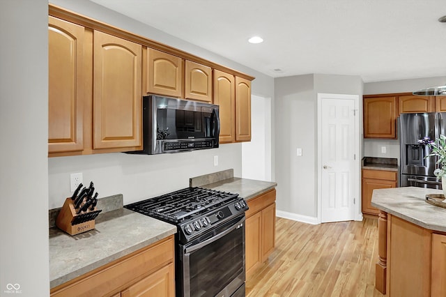 421 Lowry St, Jamestown, IN 46147 - kitchen with stainless steel appliances, light wood-style floors, recessed lighting, and light brown cabinets
