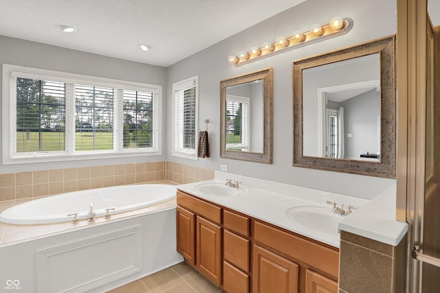 421 Lowry St, Jamestown, IN 46147 - full bathroom with a garden tub, double vanity, and tile patterned flooring