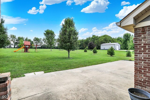 421 Lowry St, Jamestown, IN 46147 - view of green lawn featuring a playground and a patio area