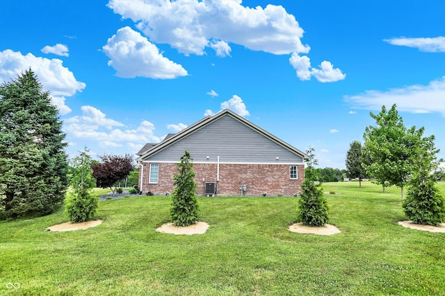 421 Lowry St, Jamestown, IN 46147 - view of side of property featuring brick siding and a lawn