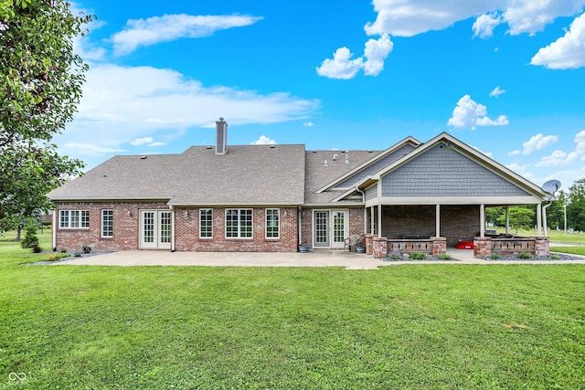 421 Lowry St, Jamestown, IN 46147 - rear view of house featuring french doors, a patio, brick siding, and a lawn
