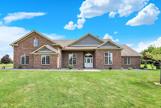 421 Lowry St, Jamestown, IN 46147 - view of front of property featuring brick siding, a front lawn, and a shingled roof
