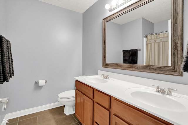 421 Lowry St, Jamestown, IN 46147 - bathroom featuring double vanity, tile patterned floors, and a textured ceiling