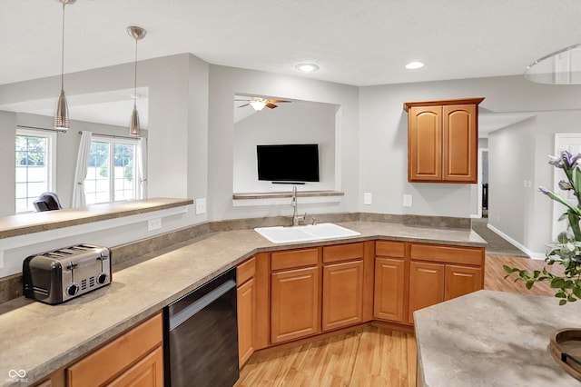 421 Lowry St, Jamestown, IN 46147 - kitchen featuring dishwashing machine, a ceiling fan, light wood-style floors, light countertops, and decorative light fixtures