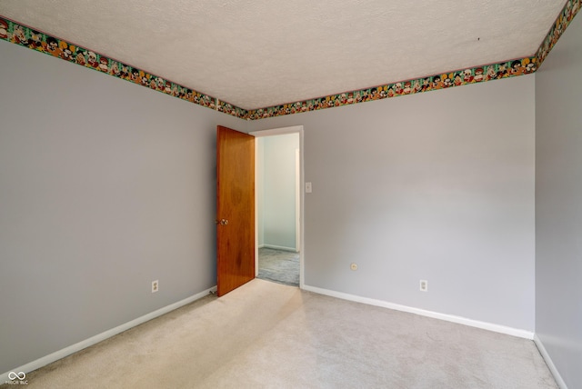 5425 Gambel Rd, Indianapolis, IN 46221 - carpeted empty room featuring baseboards and a textured ceiling