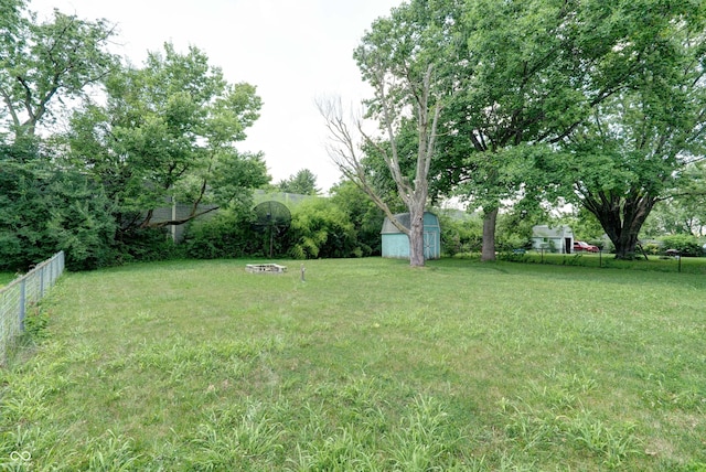 5425 Gambel Rd, Indianapolis, IN 46221 - view of yard with a storage unit and a fire pit