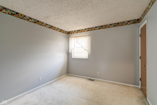 5425 Gambel Rd, Indianapolis, IN 46221 - unfurnished room featuring a textured ceiling and carpet