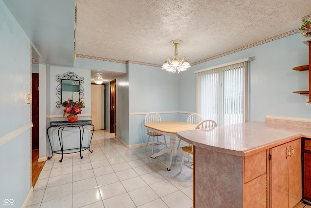 5425 Gambel Rd, Indianapolis, IN 46221 - dining room with a chandelier, a textured ceiling, and light tile patterned flooring
