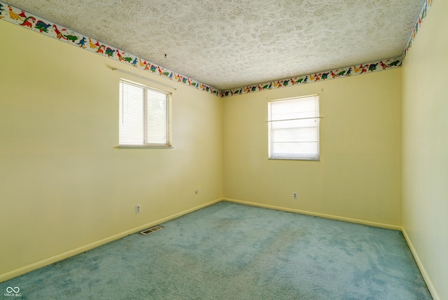 5425 Gambel Rd, Indianapolis, IN 46221 - spare room featuring a textured ceiling and carpet
