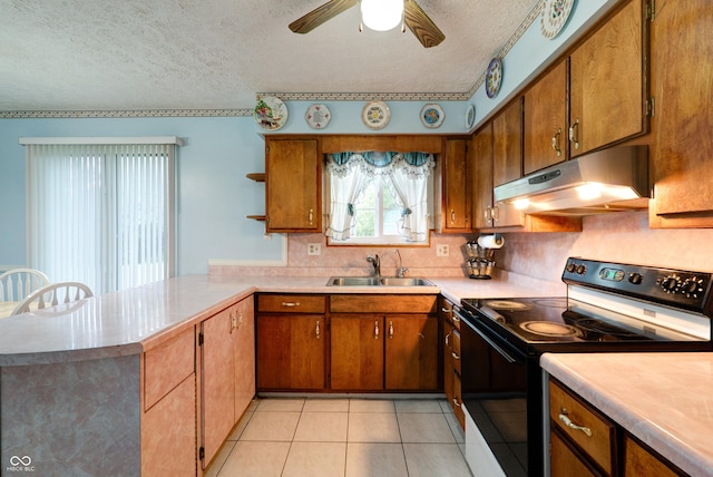 5425 Gambel Rd, Indianapolis, IN 46221 - kitchen with black electric range oven, under cabinet range hood, a textured ceiling, a peninsula, and light countertops