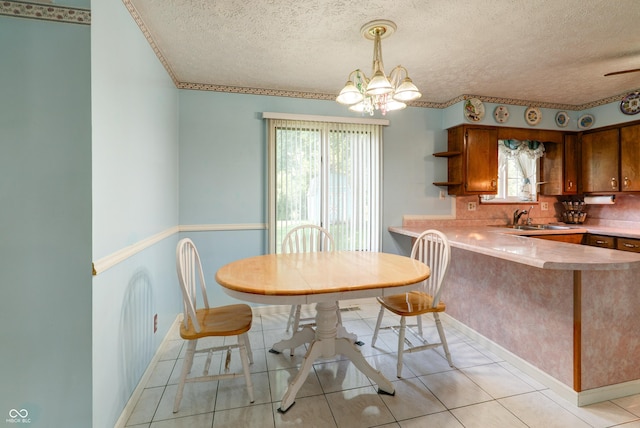 5425 Gambel Rd, Indianapolis, IN 46221 - dining space featuring a textured ceiling, a chandelier, and light tile patterned floors