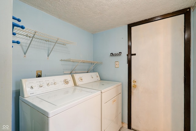 5425 Gambel Rd, Indianapolis, IN 46221 - washroom with washer and clothes dryer and a textured ceiling