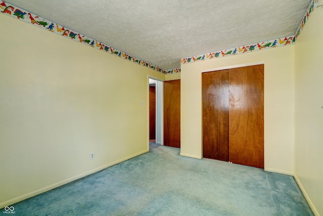 5425 Gambel Rd, Indianapolis, IN 46221 - unfurnished bedroom with a textured ceiling, carpet floors, and a closet