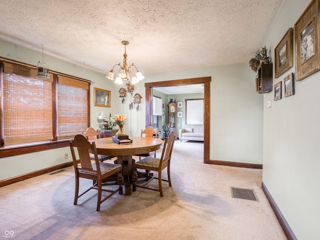 1556 E 400 S, Greenfield, IN 46140 - dining area featuring light carpet, a chandelier, and a textured ceiling