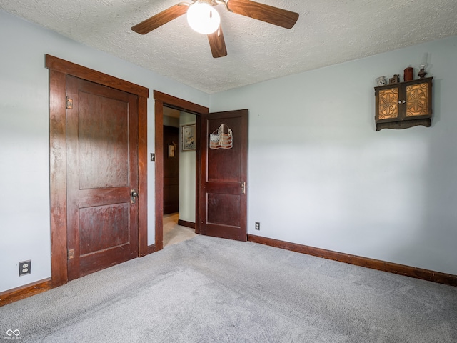 1556 E 400 S, Greenfield, IN 46140 - unfurnished bedroom with carpet flooring, a textured ceiling, and a ceiling fan