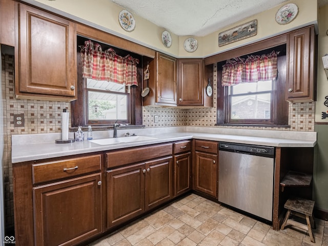 1556 E 400 S, Greenfield, IN 46140 - kitchen featuring stainless steel dishwasher, light countertops, backsplash, a textured ceiling, and light stone finish flooring