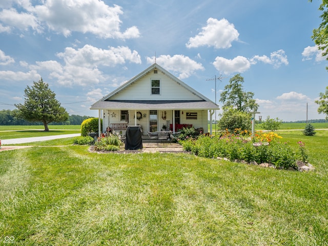 1556 E 400 S, Greenfield, IN 46140 - rear view of property with covered porch and a yard