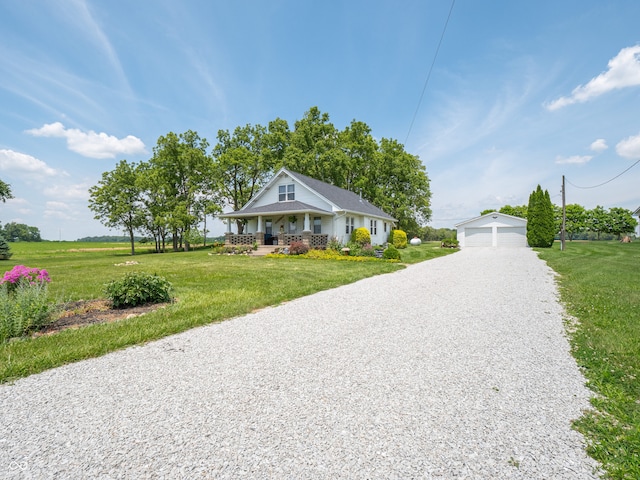 1556 E 400 S, Greenfield, IN 46140 - bungalow-style house featuring an outdoor structure, a porch, a detached garage, and a front yard