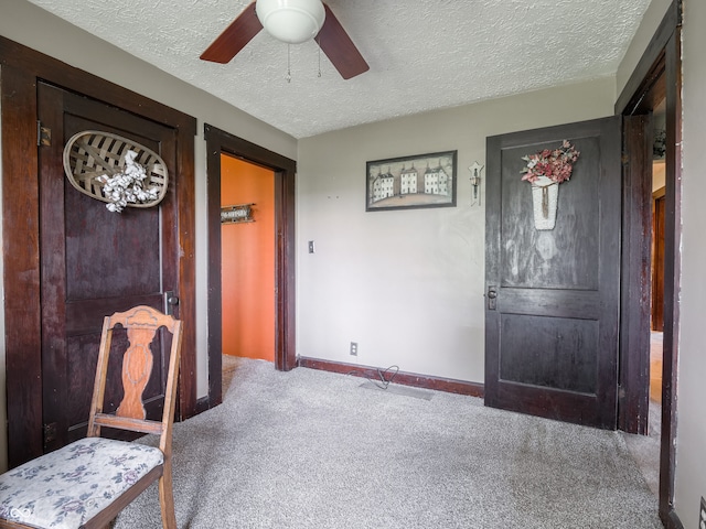 1556 E 400 S, Greenfield, IN 46140 - carpeted entrance foyer featuring a textured ceiling and ceiling fan