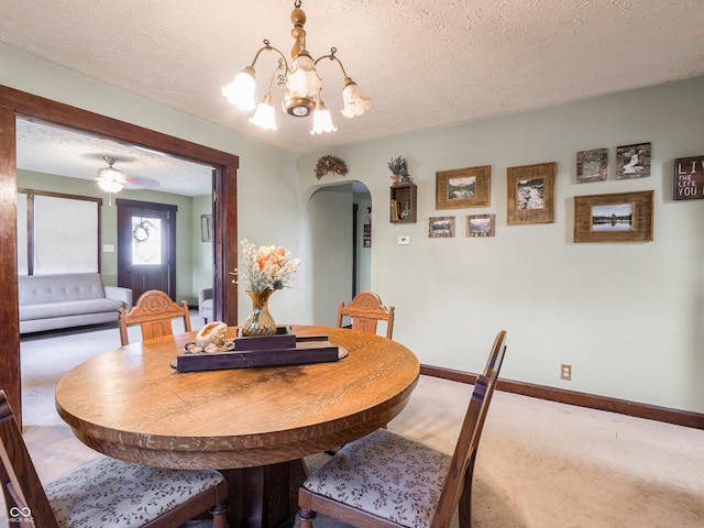 1556 E 400 S, Greenfield, IN 46140 - carpeted dining space featuring arched walkways, a chandelier, and a textured ceiling