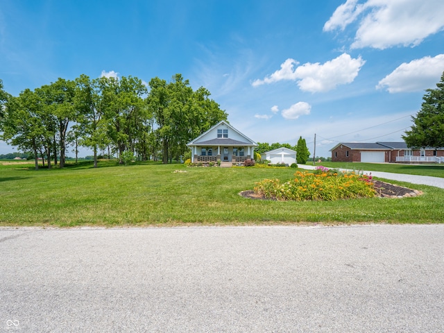 1556 E 400 S, Greenfield, IN 46140 - view of front of home with a front lawn, a detached garage, and driveway