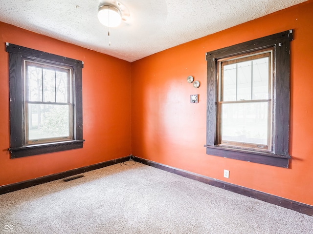 1556 E 400 S, Greenfield, IN 46140 - spare room with carpet and a textured ceiling