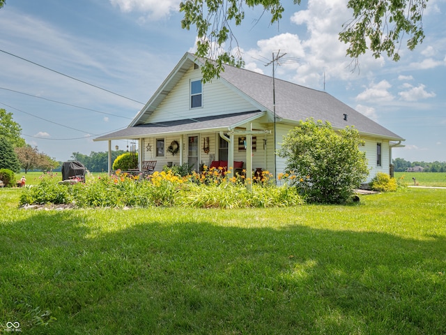 1556 E 400 S, Greenfield, IN 46140 - view of front facade with a porch and a front lawn