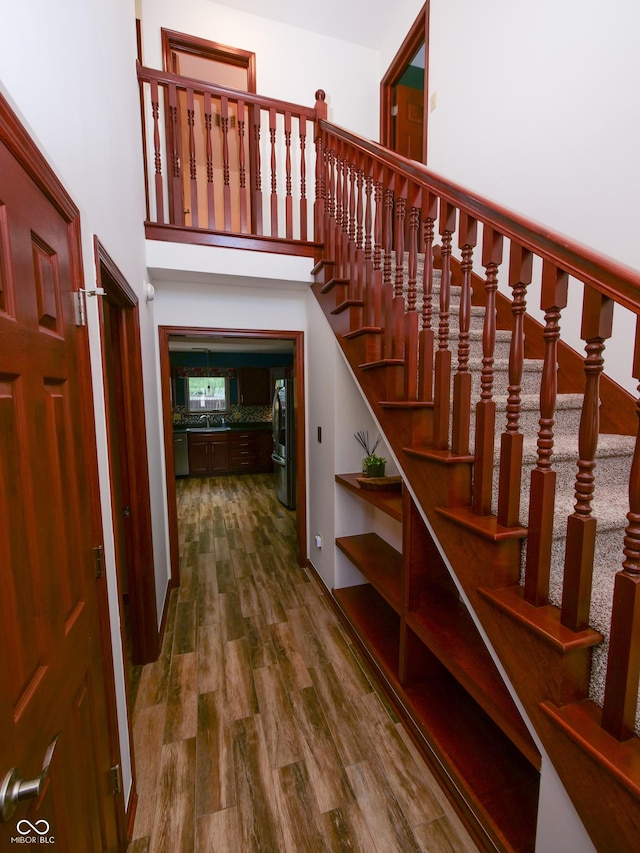 4443 W Windsong Ct, New Palestine, IN 46163 - stairs with wood finished floors and a high ceiling
