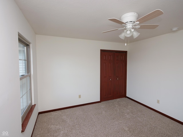 4443 W Windsong Ct, New Palestine, IN 46163 - carpeted spare room with plenty of natural light and a ceiling fan