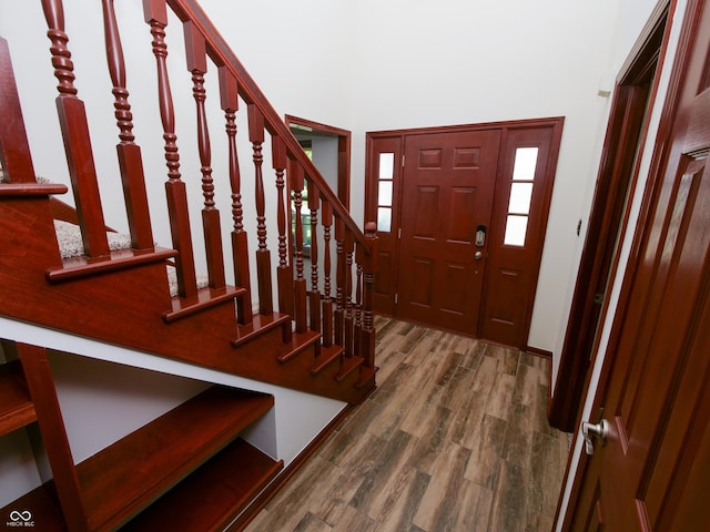 4443 W Windsong Ct, New Palestine, IN 46163 - entryway featuring wood finished floors, stairs, and a high ceiling