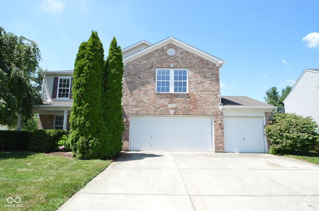 5652 Apple Branch Way, Indianapolis, IN 46237 - traditional home with brick siding, concrete driveway, a garage, and a front lawn