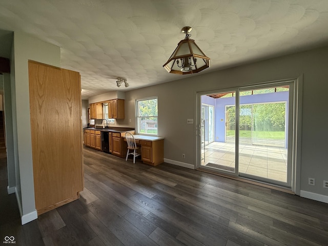 9808 E Troy Ave, Indianapolis, IN 46239 - kitchen featuring dark wood-style floors, dishwasher, and brown cabinetry