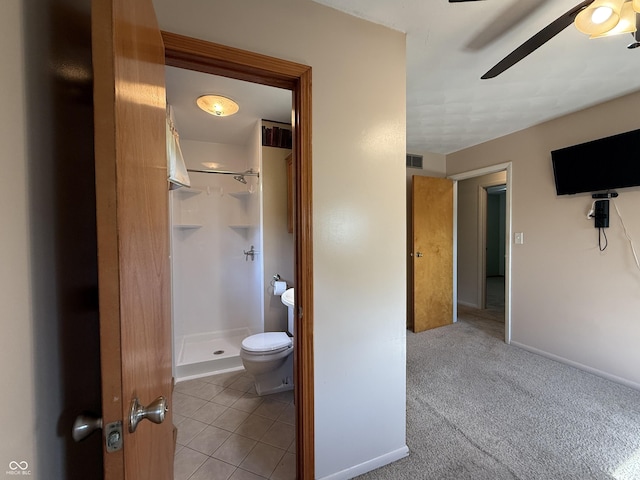 9808 E Troy Ave, Indianapolis, IN 46239 - bathroom featuring a shower stall, a ceiling fan, and tile patterned floors